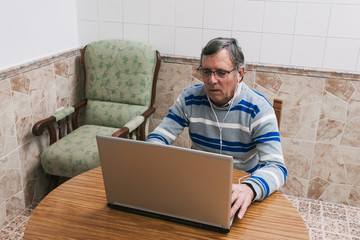 Senior man using a laptop