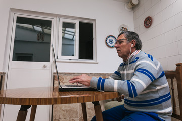 Senior man using a laptop