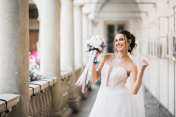 Naklejka premium Bride holding big and beautiful wedding bouquet with flowers