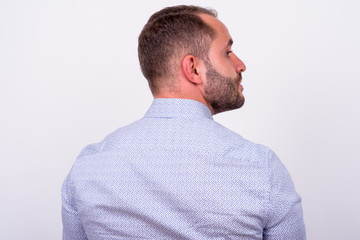 Obraz premium Rear view of bearded businessman looking away