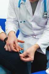 Process of taking a patient s blood samples from a finger for analysis key indicators.