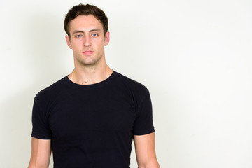 Obraz premium Portrait of young handsome man looking at camera
