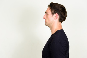 Profile view of young handsome man with wavy hair