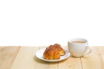Coffee and croissants on the wood