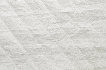 White and multicolored wrinkled paper surface, top view