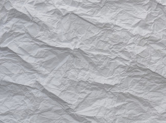 White and multicolored wrinkled paper surface, top view