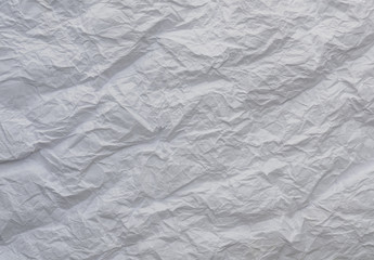 White and multicolored wrinkled paper surface, top view