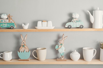 Shelf with dishes. Kitchenware on wooden shelves. Kitchen interior Easter background. Minimalistic cozy light home style. Scandinavian interior