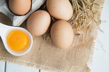 Eggs chicken on white wood background