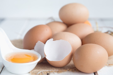 Eggs chicken on white wood background