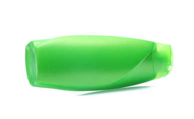 Green Plastic bottle of shampoo isolated on white background