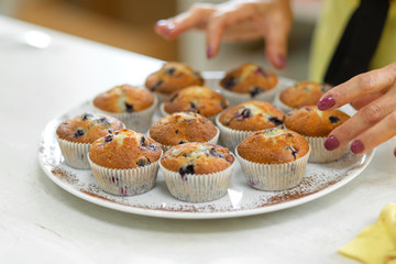 Plate with freshly baked sweet muffins. Sweet pastries, recipes, cooking