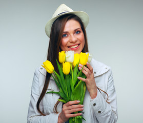 Hipster girl holding flowers bouquet.