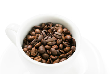 Coffee beans in a coffee cup isolated on white background, select focus with clipping path