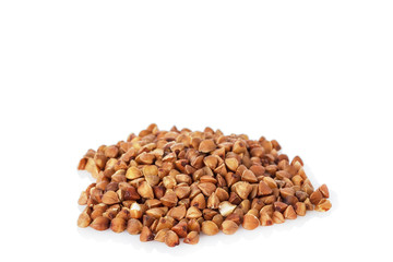 The buckwheat is scattered on a white background isolated.