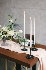 Table setting at a luxury wedding and Beautiful flowers in a vase on the table.