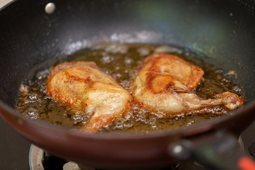 Fry the chicken in a pan with boiling oil.