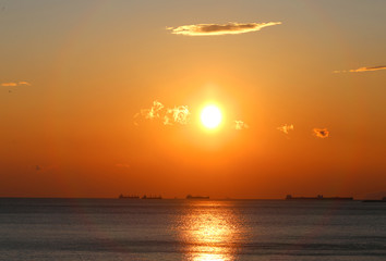 Photo of a beautiful sunset with clouds on the sea coast