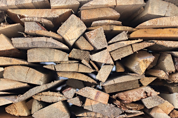 Close up background of a stack of firewood. Woodpile