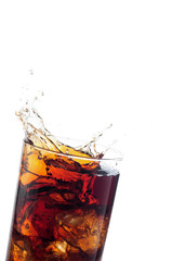 A tall glass with ice and refreshing cola like colored drink.