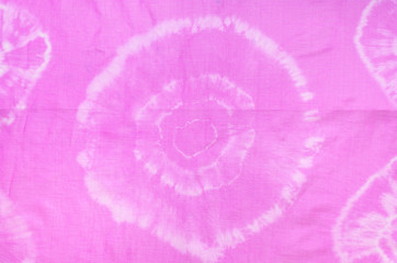 fragment of abstract pattern of pink scarf