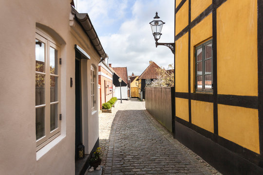 Denmark, Ribe, Cobblestone alley between town houses