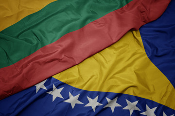 waving colorful flag of bosnia and herzegovina and national flag of lithuania.