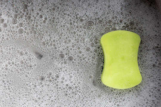 Sponge with bubbles in the sink.