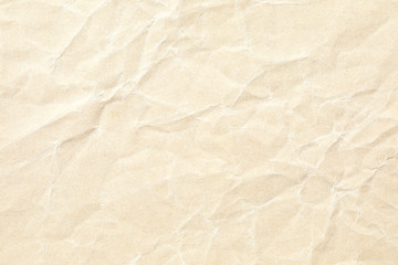 Fototapeta na wymiar light yellow crumpled paper background texture 