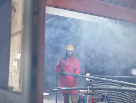 Installer preparing platic pipes on construction  site