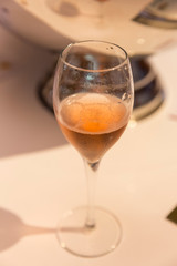 A glass of sparkling pink champagne