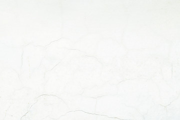 Obraz premium White cracked cement wall surface