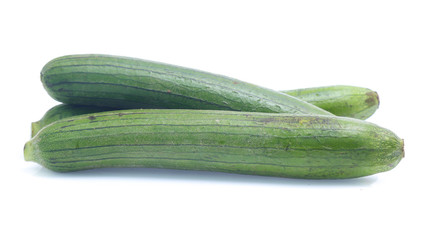 fresh green sponge gourd or luffa with slice isolated on white background