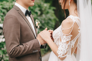 newlyweds hold hands, wedding walk, bride and groom
