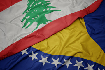 waving colorful flag of bosnia and herzegovina and national flag of lebanon.