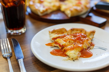 Seafood Italian Pizza slice on wood dish