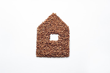 buckwheat in the form of a house on a white background, coronavirus food