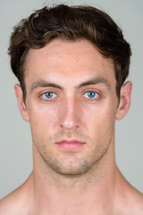Obraz premium Face of young handsome shirtless man looking at camera
