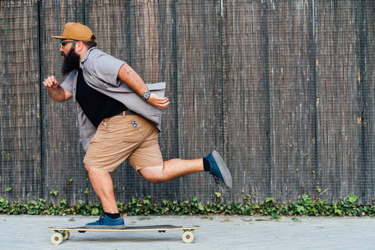 Mature man skateboarding