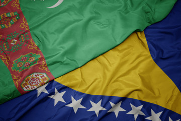 waving colorful flag of bosnia and herzegovina and national flag of turkmenistan.