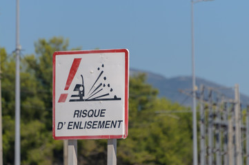 French sign at a beach warning drivers "Risque d'Enlisement" (Risk of sinking), Nice, France