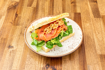 salmon focaccia on wooden table