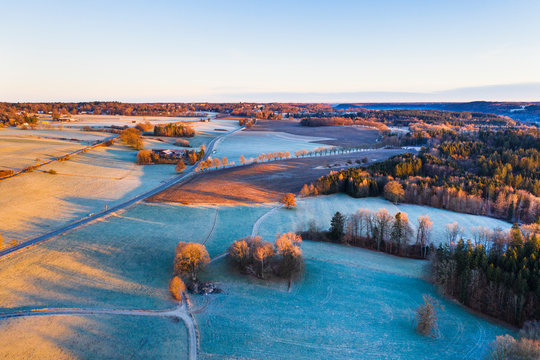 Germany, Bavaria, Icking, Drone view of?winter countryside at dawn