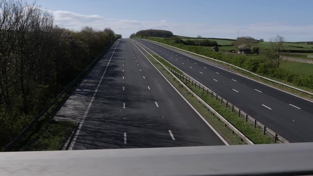 4K: Empty Deserted UK motorway with no traffic during Lockdown for COVID-19 Coronavirus. Gimbal shot. Stock Video Clip Footage