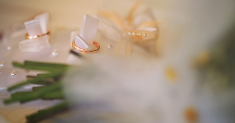 golden ring for wedding ceremony on white band