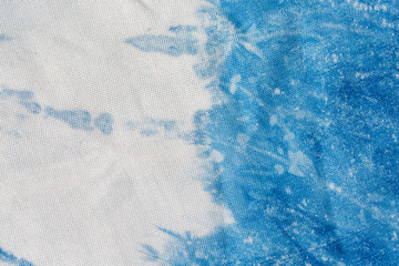 The fabric indigo tie dye as a background and texture.