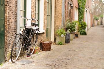 Fototapeta na wymiar Bicycles parked on a quaint Dutch street in The Netherlands.