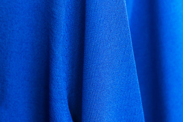 Knitwear blue sweater texture, close up