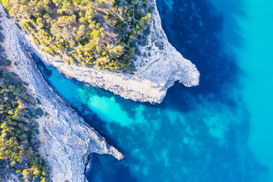 Spain, Balearic Islands, Santanyi, Aerial view of cliffs of Calo den Perdiu in Mondrago Natural Park