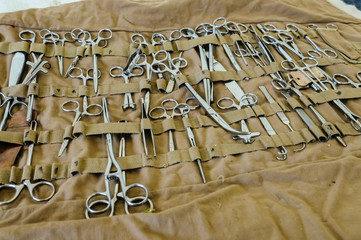 Large selection of stainless steel surgical equipment, including artery forceps, tweezers,...